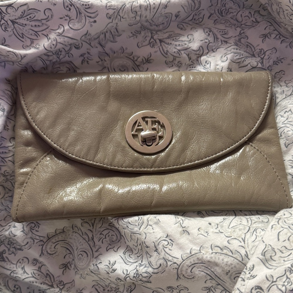 American Eagle Outfitters taupe leather clutch with AE logo turn-lock